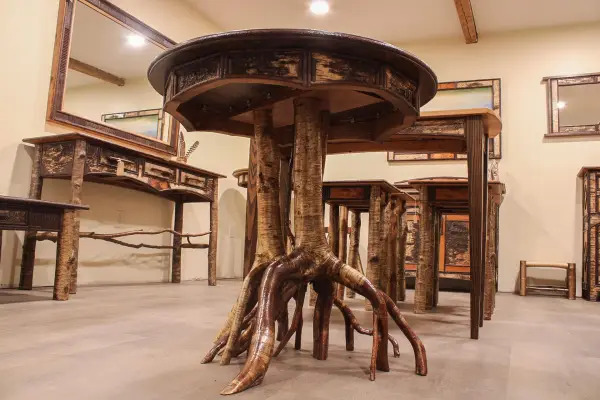 End table made with birch bark and multitrunk white birch legs
