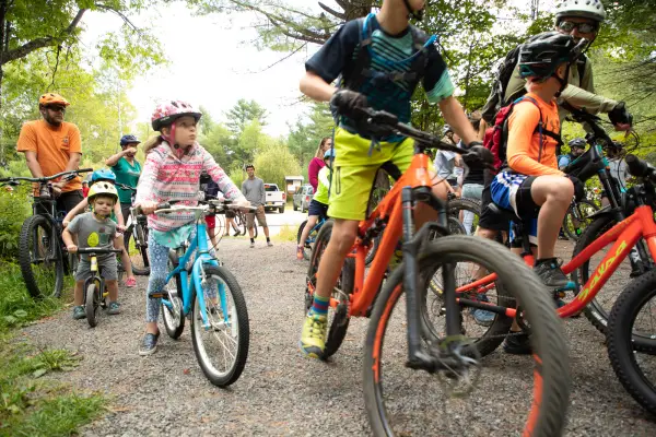 Group of colorful outfits and bikes with participants of all ages