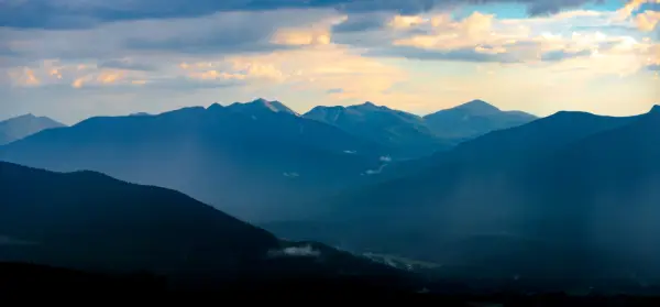A sunset view of dozens of mountains