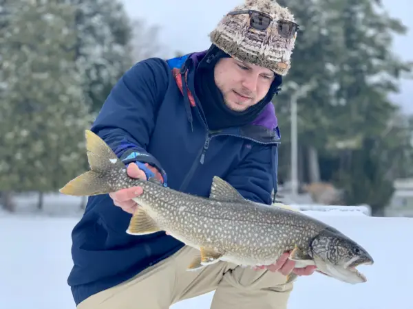 Man holding Atlantic Salmon.