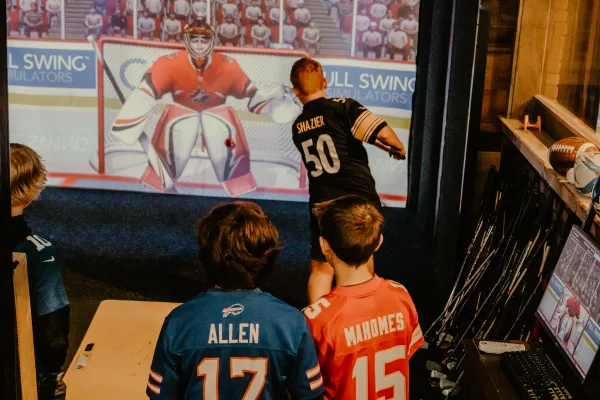 kids play simulator hockey.  Photo Credit to A. Kelly.