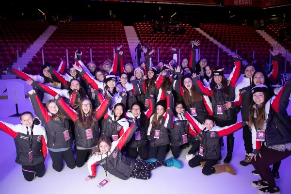 A group of athletes posing for a picture at the opening ceremony.