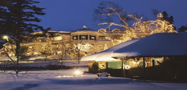 The Inn illuminated in warm winter light reflecting off the blanket snow