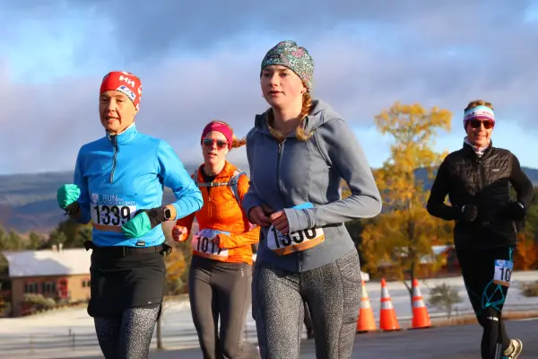 Four runners wearing warm clothes