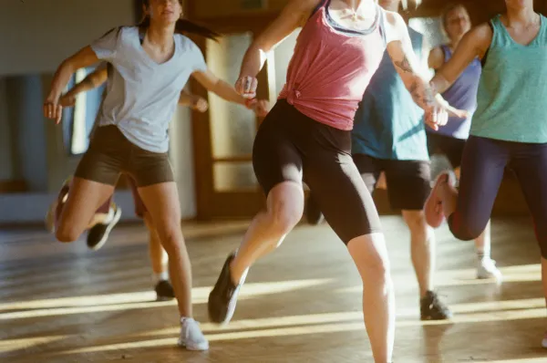 Stock image of people dancing in exercise class