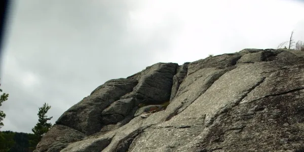 Bear Den Mountain has a rocky bluff.
