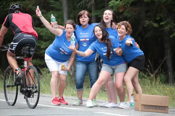 A joyful bunch of volunteers out on course handing out water.