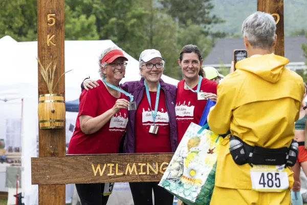 Racers get their photo taken in Whiskey Run photo frame