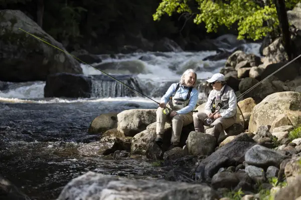 two women fly fishing in the ausable river