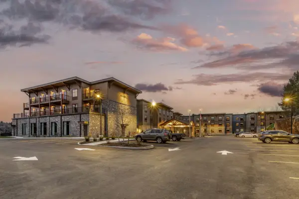 Twilight at the Cambria, showing the front entry way and ample parking on property
