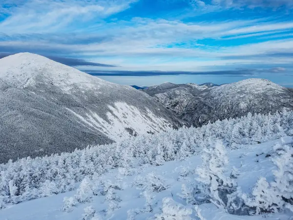 A view of snow-covered mountains under foreboding clouds