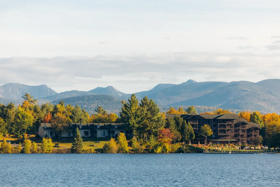 A group of waterfront resorts on a lake in fall.