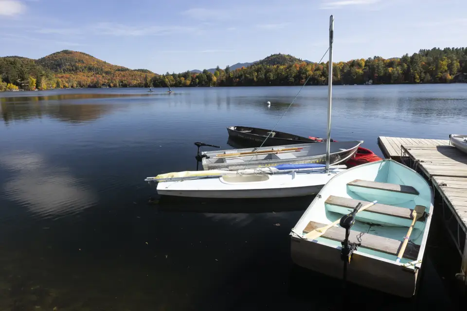Sailboats docked on a shore.