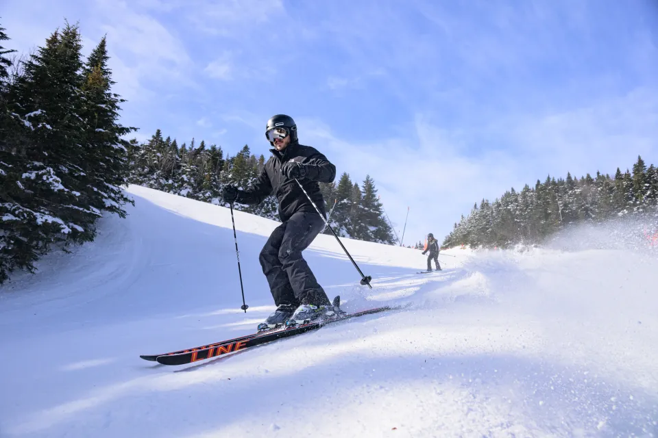 A person skiing down a trail at Whiteface Mountain.