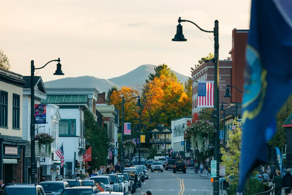 A charming American downtown with fall foliage in the background.