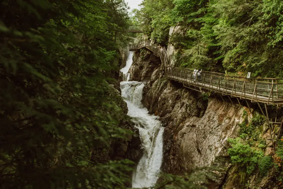 High falls gorge gushing with water among jagged rocks.