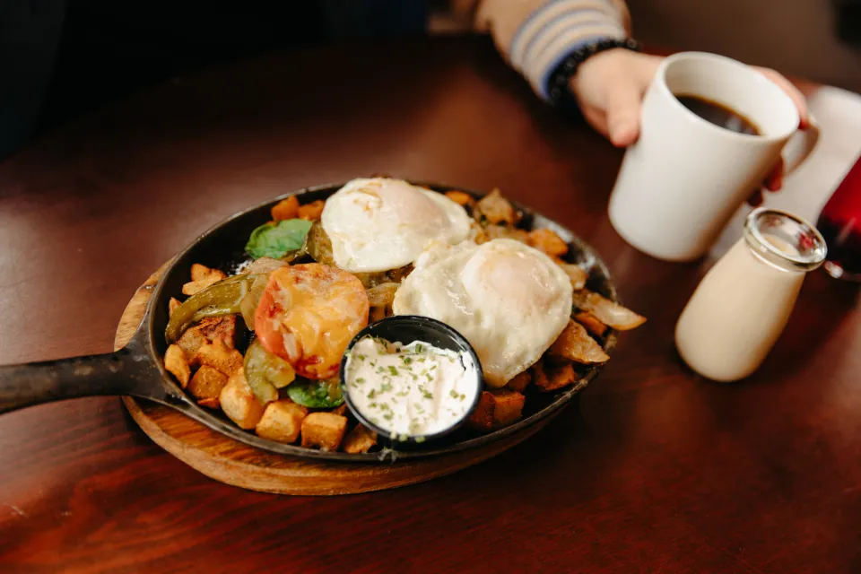 A cast iron skillet breakfast platter.