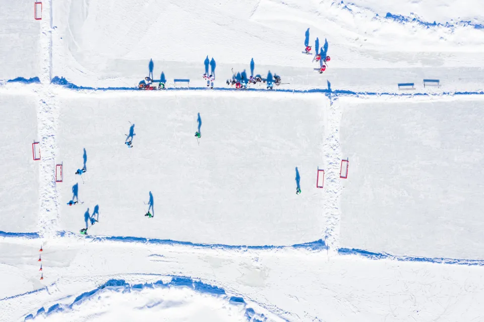 Aerial of people skating on Mirror Lake, Lake Placid, NY.