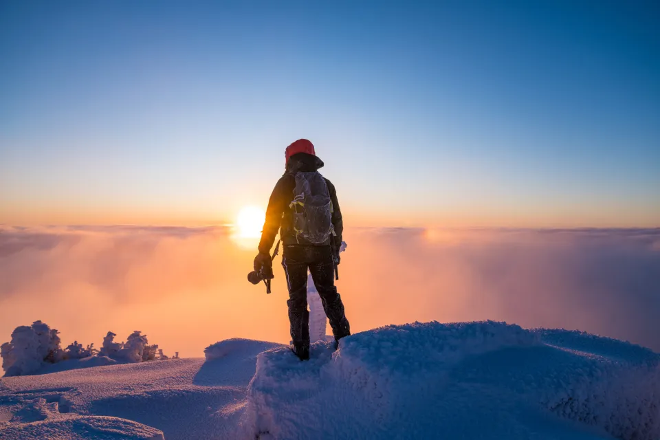 Snowshoeing to a summit.