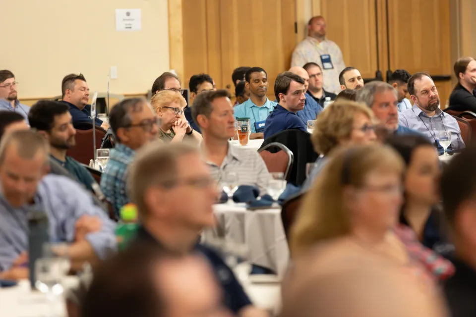 large group of people sitting at tables