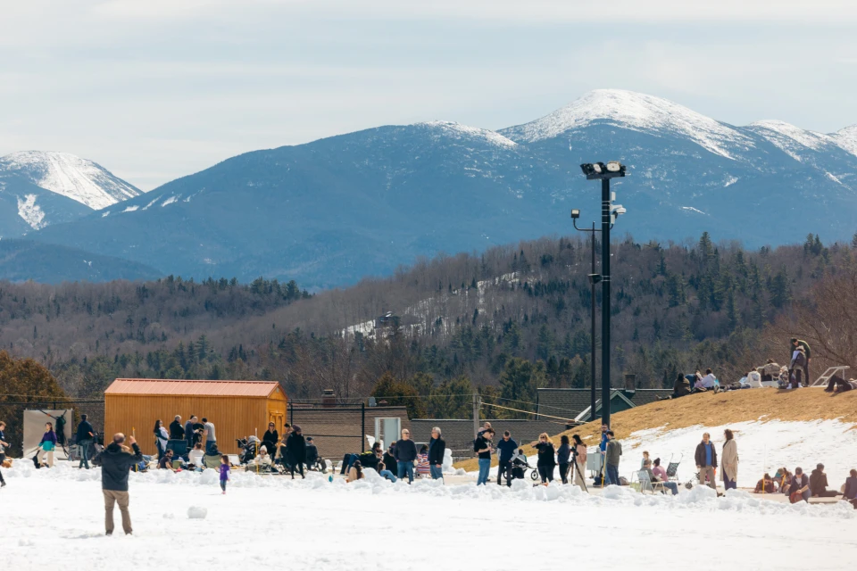 A group of people in Lake Placid watching the solar eclipse in 2024.