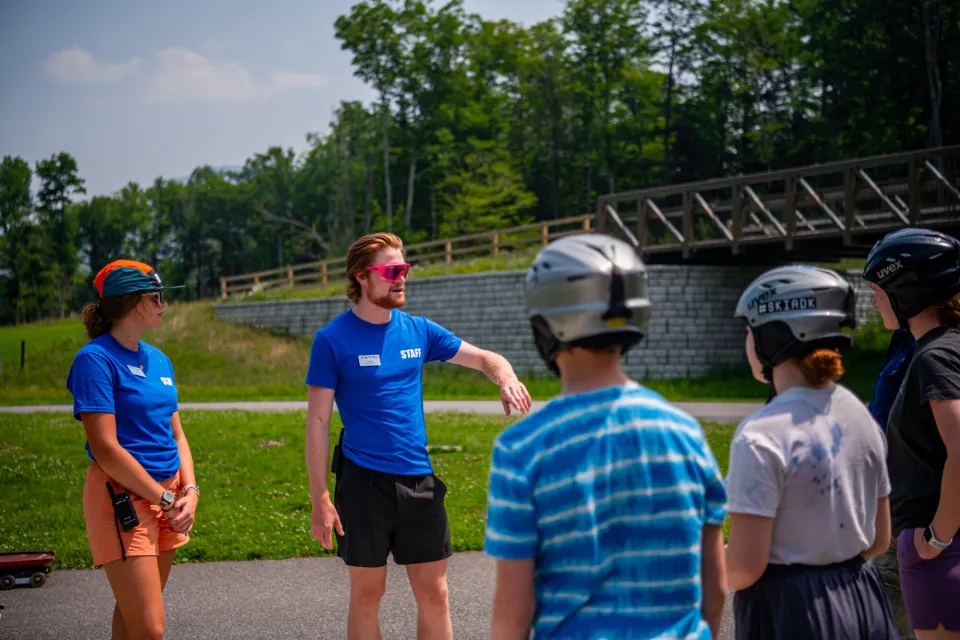 Instructors teaching safety of an activity at Mt Van Hoevenberg