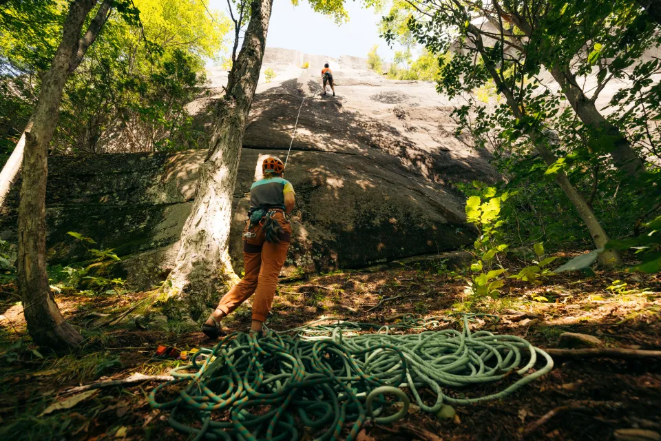 A belayer and a climber at a crag