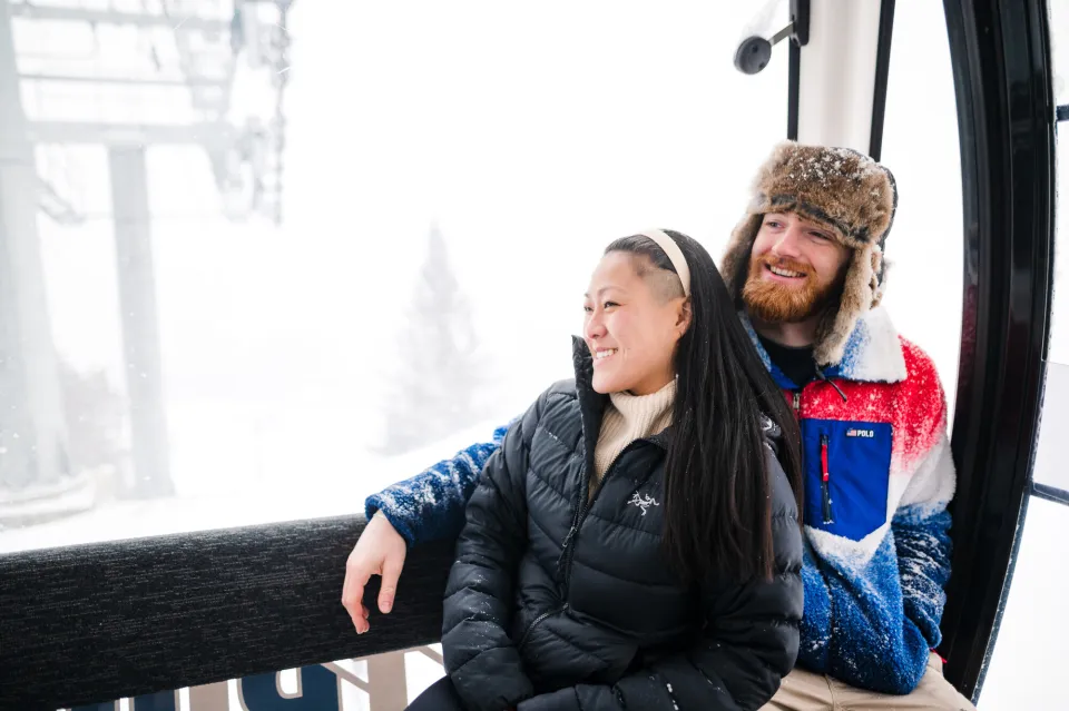 A couple riding the Sky Ride Gondola.