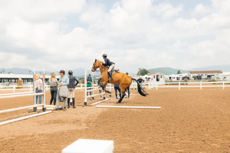 A person riding a horse at the Lake Placid horse show.