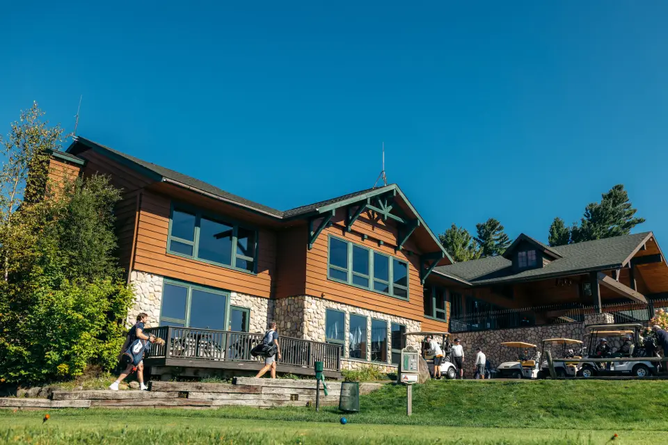 A golf club house on a summer day.