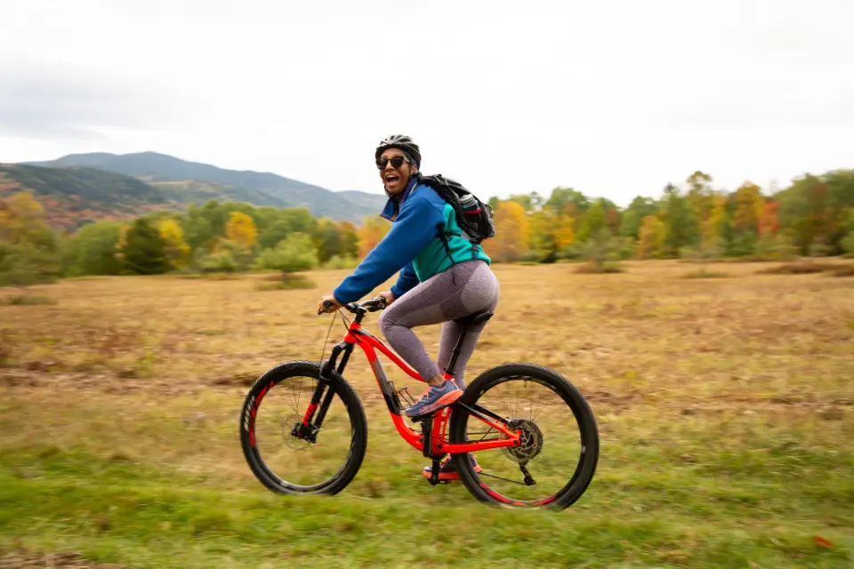 A mountain biker on an open trail in the fall