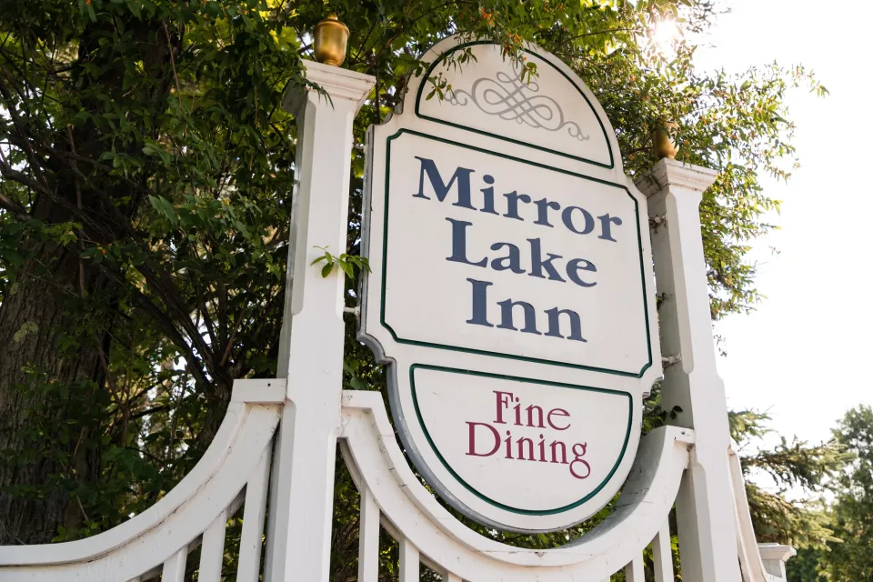 A sign for a hotel that reads: "Mirror Lake Inn, Fine Dining."
