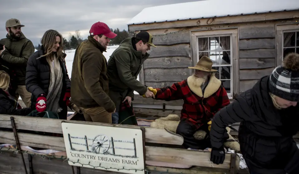 A group of people on a snowy sleigh ride