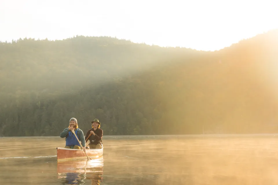 Two people in a canoe during the spring