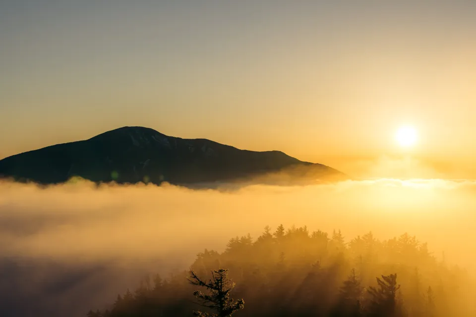 The summit of big slide during a foggy sunrise.