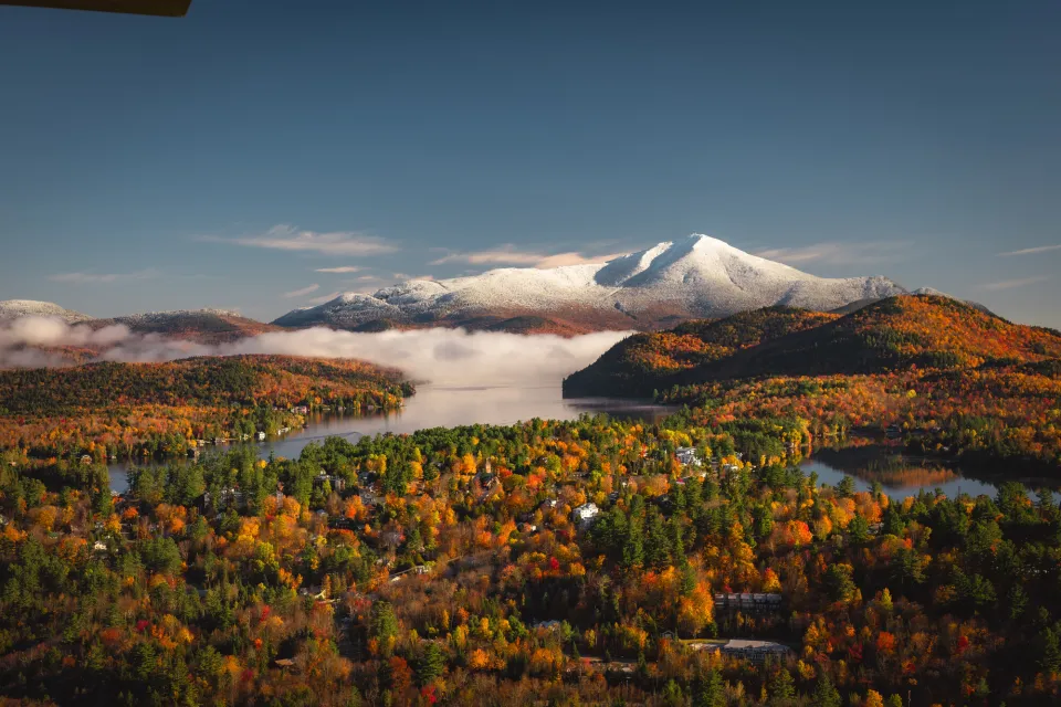whiteface mountain covered in snow during fall.