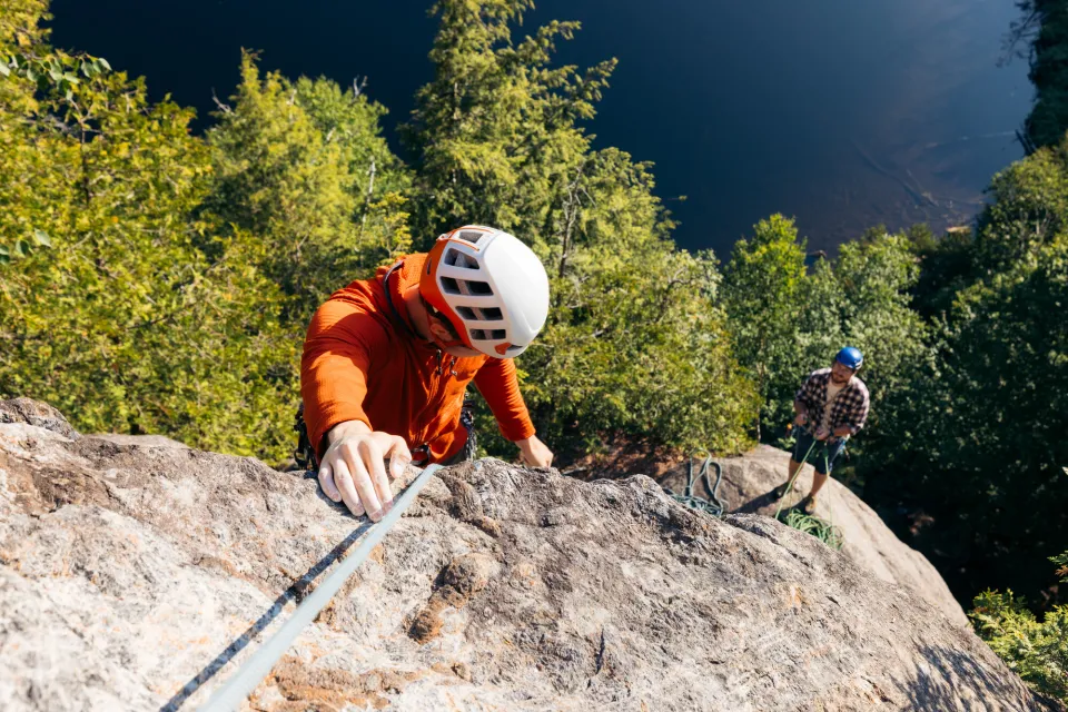 Two climbers on a multi-pitch route above Chapel Pond