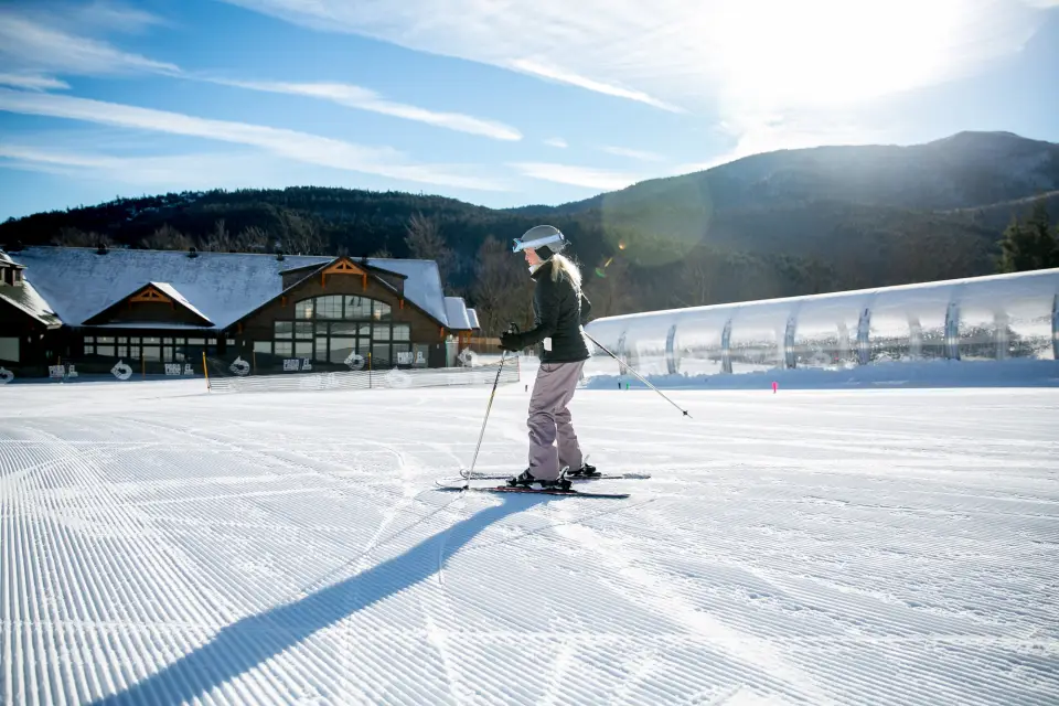 A person skiing down a green trail at Bear Den Mountain.