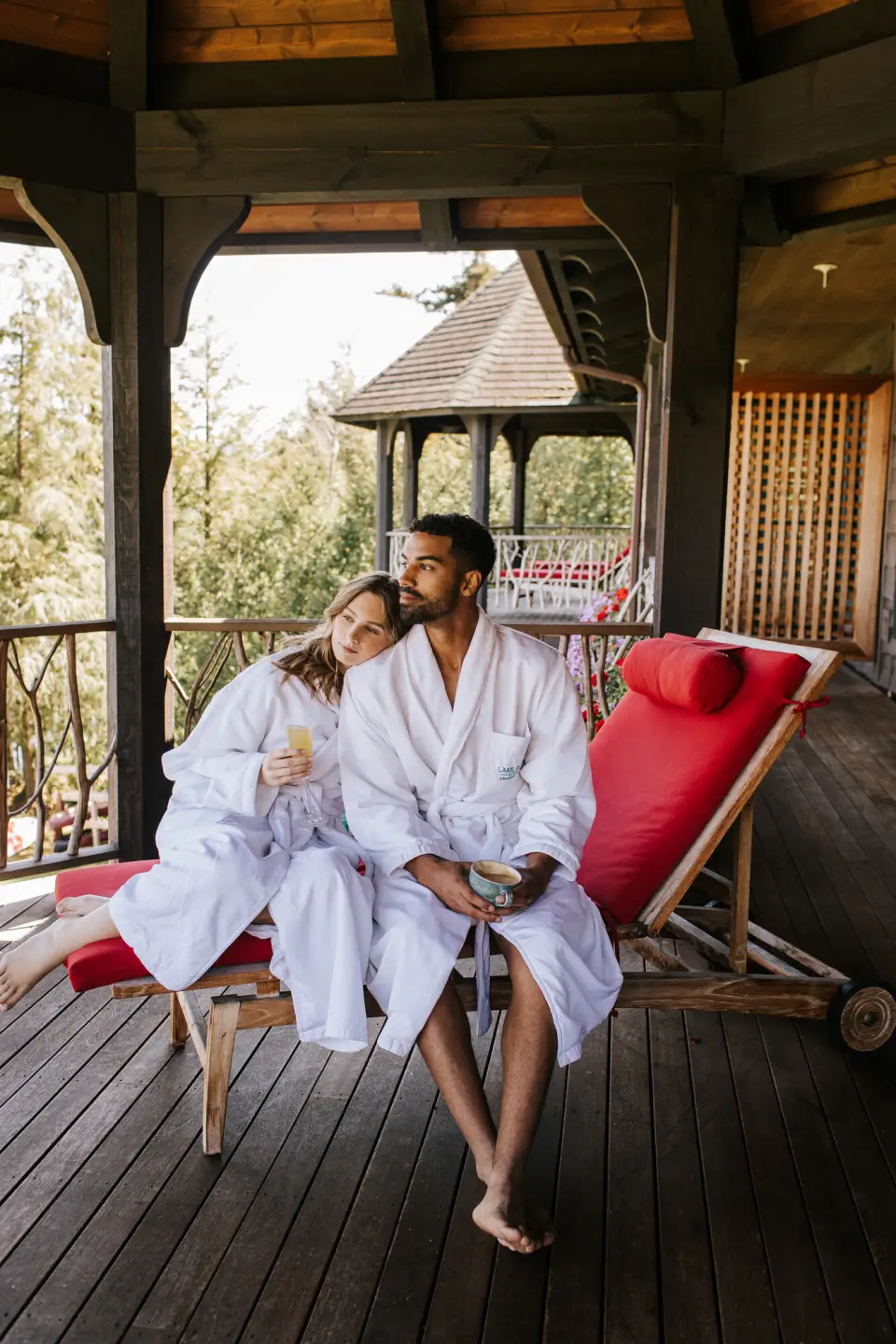 A couple sitting on the patio of a spa in Lake Placid.