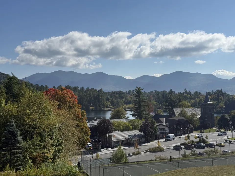 Fall foliage in Lake Placid with mountain views.